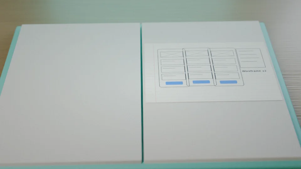 A notebook with wireframe sketches